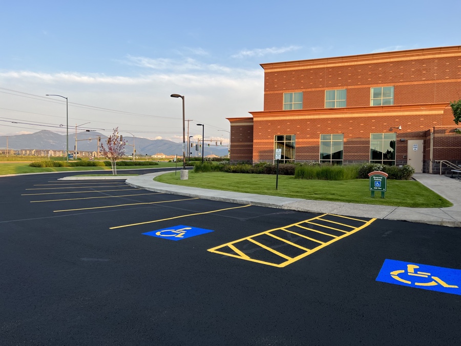Striped parking lot with clearly marked handicap parking spaces