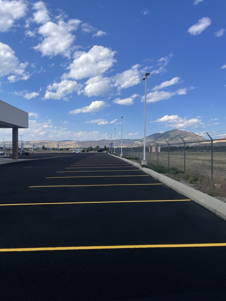 Sealcoated retail parking lot with directional arrows and clean layout