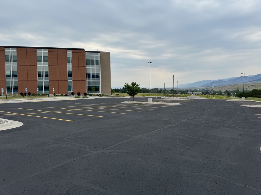 Commercial parking lot freshly sealcoated by Montana Sealcoating in Helena, MT.
