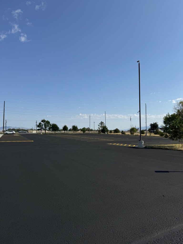 Sealcoated retail parking lot with directional arrows and clean layout