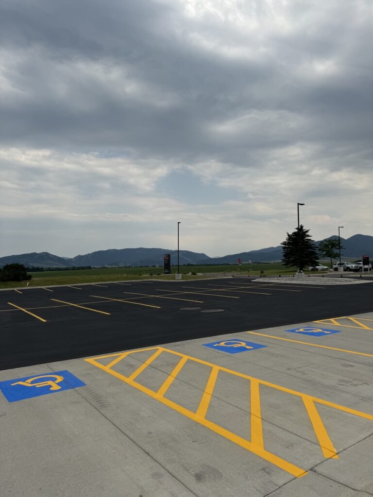 Striped parking lot with clearly marked handicap parking spaces